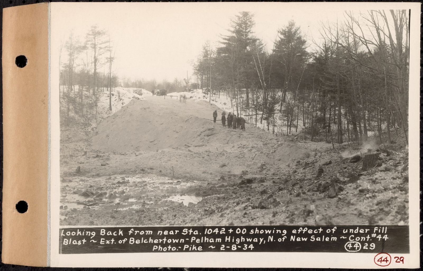 Contract No. 44, Extension of Belchertown-Pelham Highway, New Salem, Orange, looking back from near Sta. 1042+00 showing affect of underfill blast, New Salem, Mass., Feb. 8, 1934, Massachusetts Archives - undated