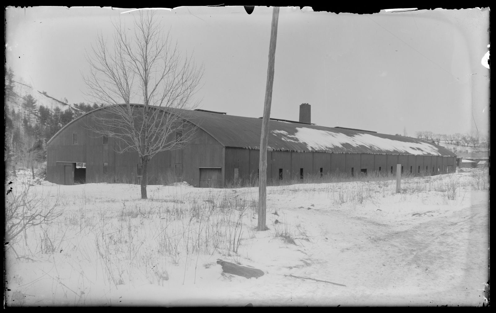 The largest building in the world at that time, the Lenox glass works across the road from Augustus Martin., Lenox Library Association - undated