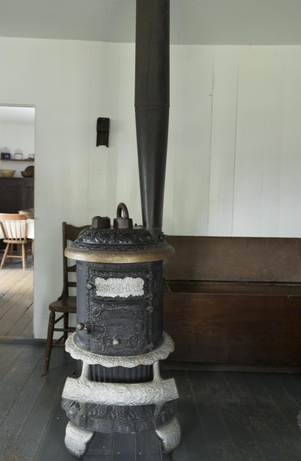 Woodburning fireplace in the farmhouse kitchen at Yoder's Amish Home, an authentic Amish farm that began accepting visitors in 1983 near Walnut Creek in central Ohio, along the "Amish Country Byway"