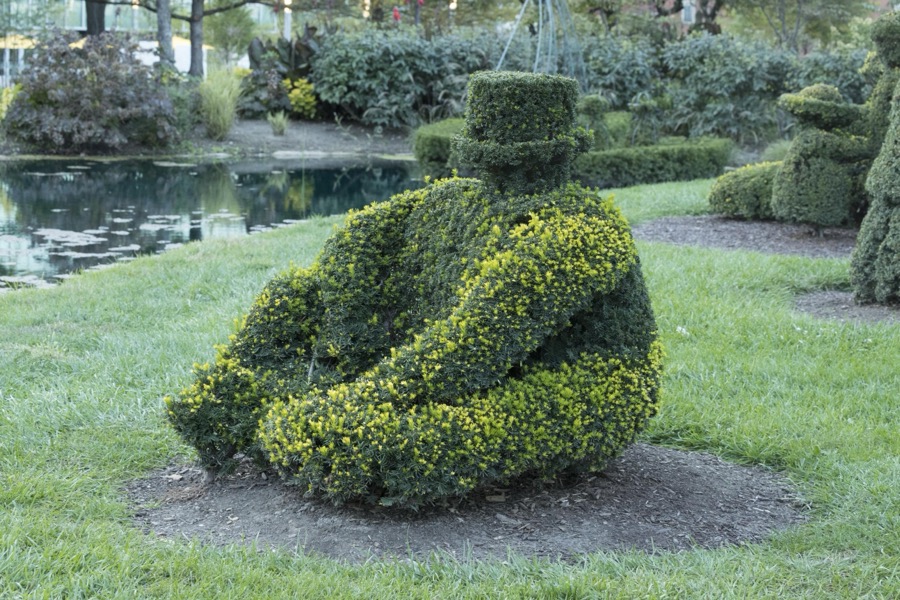 This and other clipped shrub figures in the Topiary Garden in downtown Columbus, Ohio, at the Old Deaf School Park, were created to represent those in a classic painting, "Sunday Afternoon on the Island of La Grande Jatte," by Georges Seurat