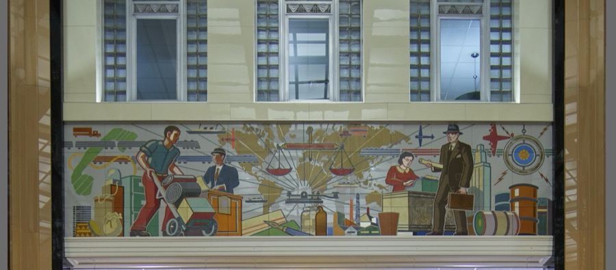One of several sleek glass Vitrolite-tile glass murals from the mid-20th Century that epitomized the ultramodern look, lining the 1940 core building of the Toledo-Lucas County Public Library in Toledo, Ohio, which added a modernist wing in 2001