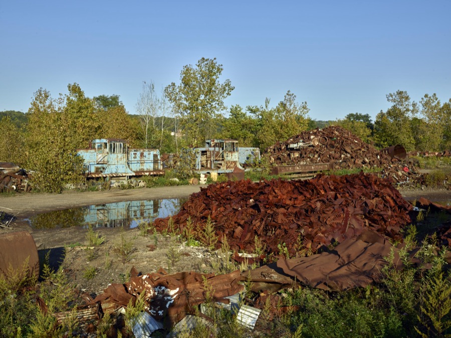 Rusted steel-mill remnants and trains in Mahoning County, Ohio, along a stretch of abandoned mills that once bustled  with activity beside the Mahoning River between Youngstown and Struthers