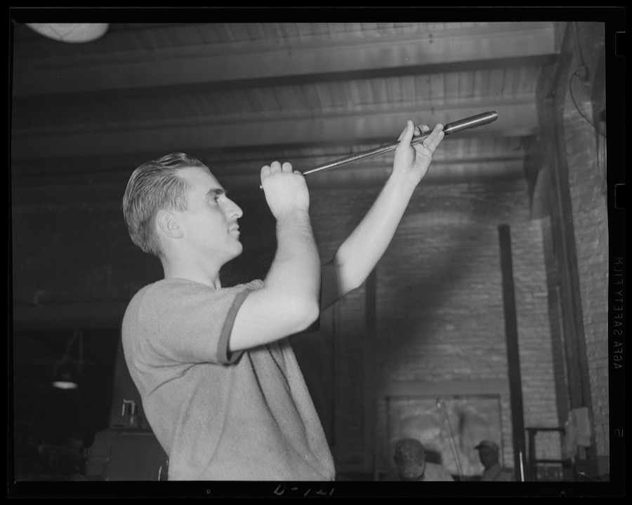 Making sure. A workman inspecting bore of a complete barrel for a Garand rifle, the new infantry weapon used in the war program