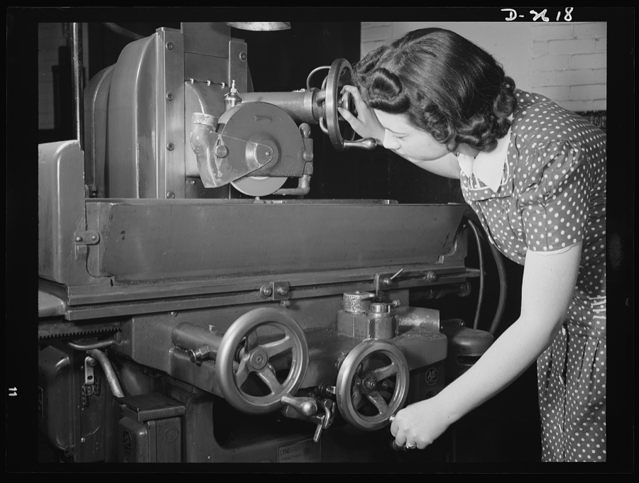 Conversion. Safety razor plant. Because of their dexterity and precision in the operation of light-duty machines, women are appearing in ever-increasing numbers on America's production lines. Here Estelle Wilson resharpens grinding wheel with a diamond point, first step toward converting one of a razor company's machines to war production work. Gillette