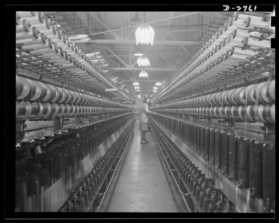 Fiberglass manufacture, Owens-Corning, Toledo, Ohio. Fiberglass yarns are twisted and plied on standard textile machinery as a step in the manufacture of tapes and cloths, used principally to insulate electric equipment operating under heavier loads today than ever before