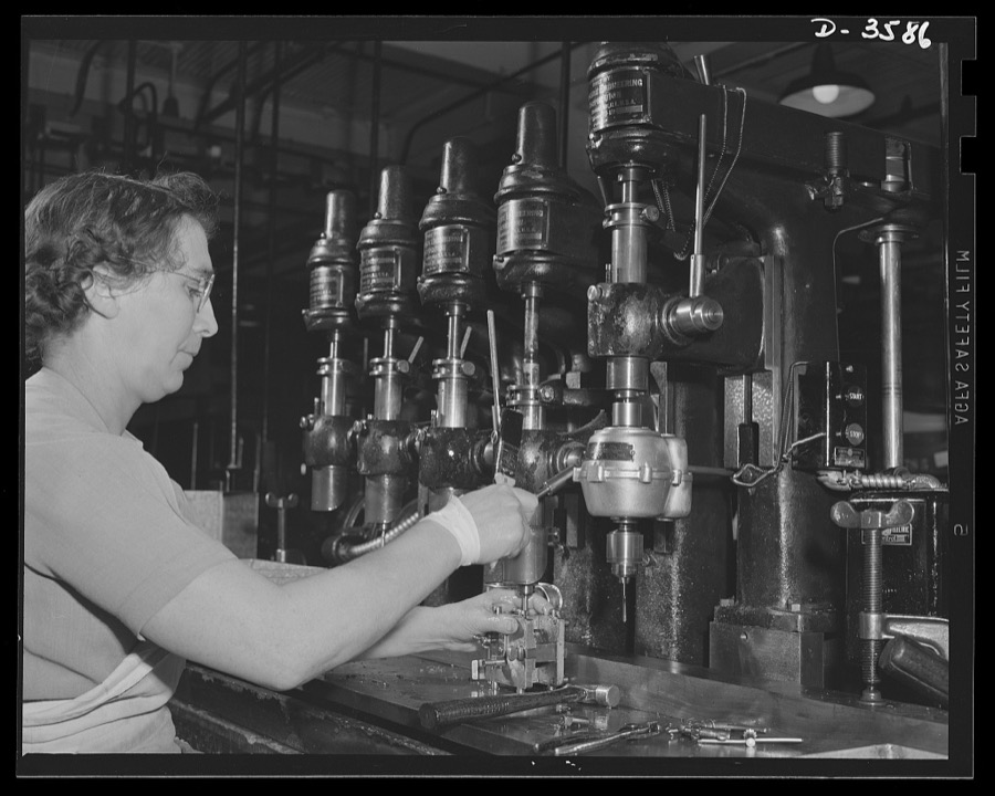 Conversion. Cash registers to gun magazines. A multiple drill press operation in the making of Oerliken magazines for 20mm anti-aircraft guns. The converted cash register manufacturing plant doing the work adapted many of its regular workers and machines to the new job. National Cash Register Company, Dayton, Ohio