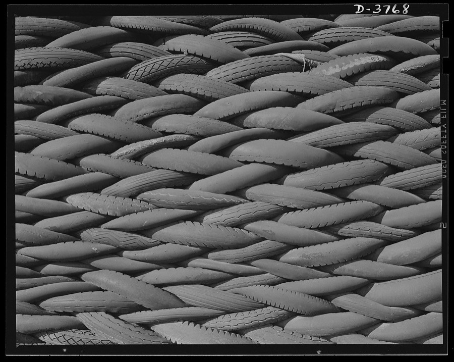 Rubber reclamation. Scrap tires mobilized for Victory. Millions of discarded casings cover more than 100 acres at one Midwest recovery plant. Systematic piling and sectional arrangement reduce fire hazard. Special processes will separate metal from the tires and tube bodies. The reclaimed material will be used to manufacture thousands of essential mechanical rubber products. Firestone