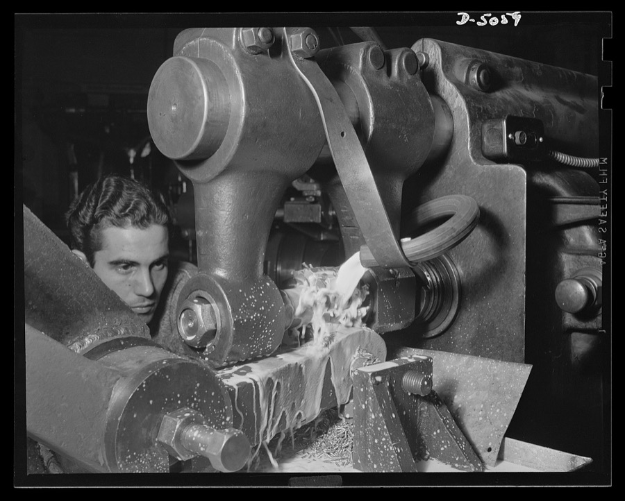 Subcontracting. Bogie-wheel assembly. Milling a slot in the rubbing plate of a bogie-wheel assembly. An Eastern subcontractor is doing the work in a machine shop set up in an unused garage. Painesville Machine Company