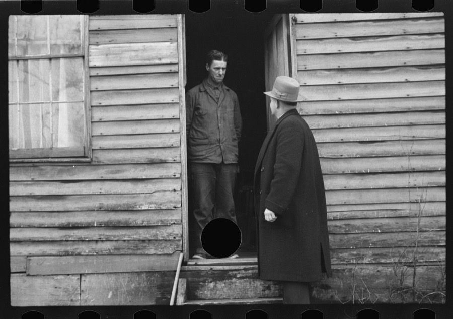 Resettlement Administration representative at door of rehabilitation client's house, Jackson County, Ohio