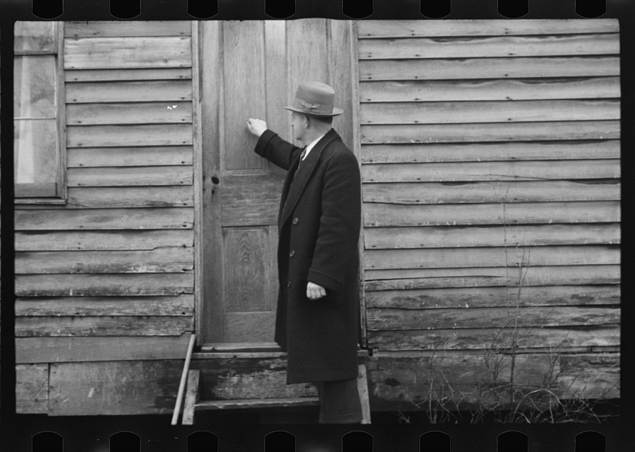 Resettlement Administration representative at door of rehabilitation client's house, Jackson County, Ohio