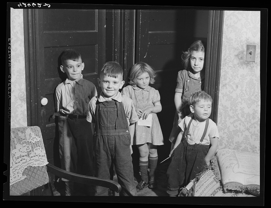Because of the shortage of housing in Quincy, families with large number of children are finding it almost impossible to find a house. Real estate agents, realizing that their houses are in demand have become very choosy about their tenants. These children are some that belong to two families. One has five and the other six. Both families living in one house which is very inadequate.  Massachusetts