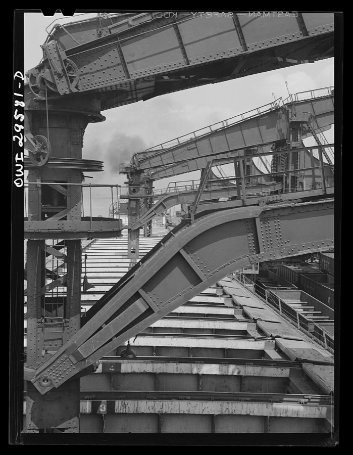 Cleveland, Ohio. Unloading a lake freighter by means of Hewlett [i.e., Hulett] unloaders at the Pennsylvania Railroad iron ore docks