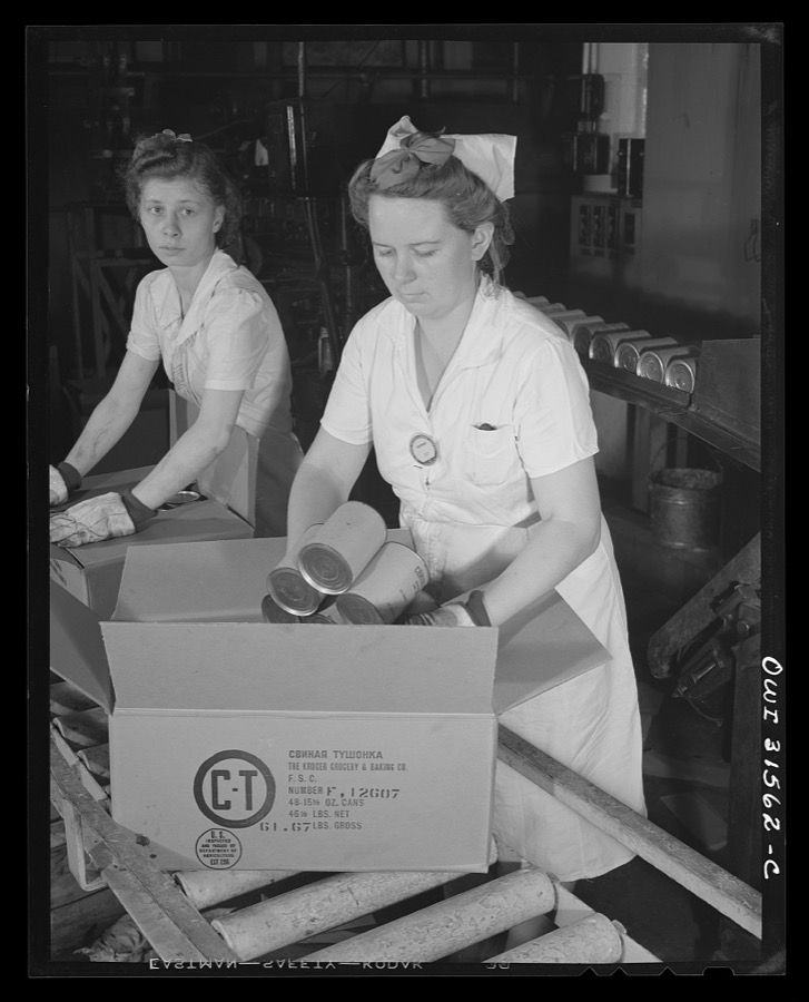Cincinnati, Ohio. Preparing canned pork (Russian: "svinaia tushonka") for lend-lease shipment to the USSR at the Kroger grocery and baking company. Marie Greebe packing the finished cans of pork