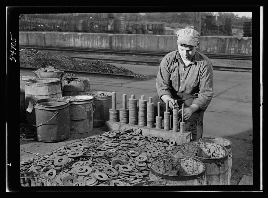 Boston and Maine railroad shops at Billerica, Massachusetts. Sorting iron washers according to size. Many of these will be used over and over again