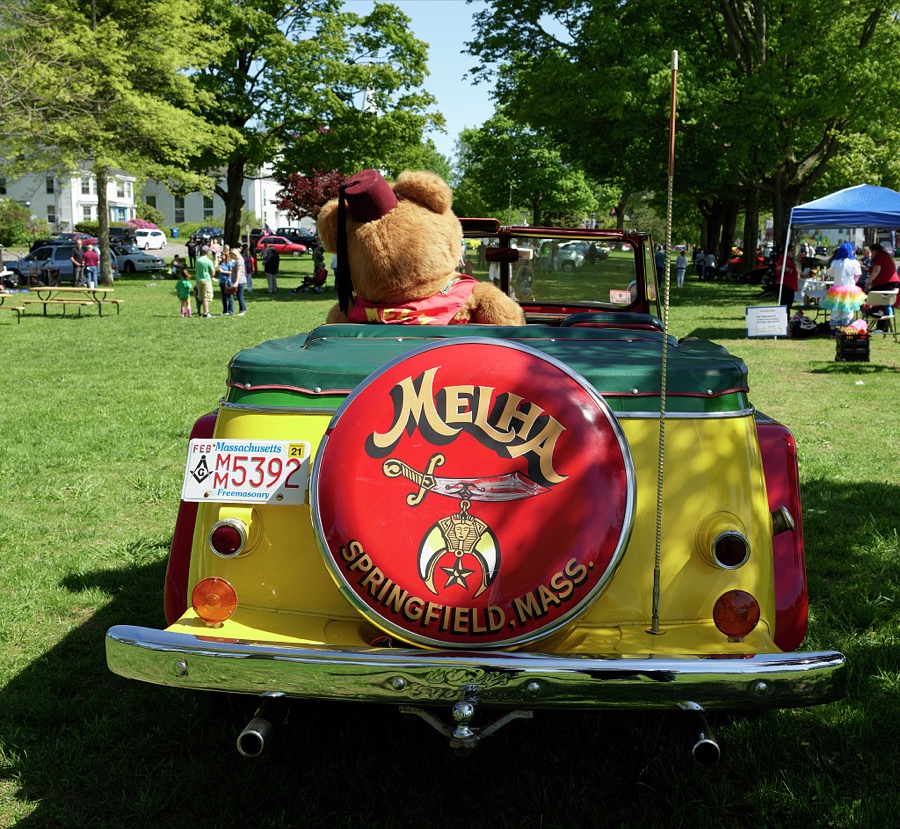 This colorful 1949 Willys Jeepster, exhibited at a small antique-car show on the green in [Belchertown], Massachusetts, is one of several small cars used by the Melha Shriners, a funloving Masonic group that delights crowds in area parades